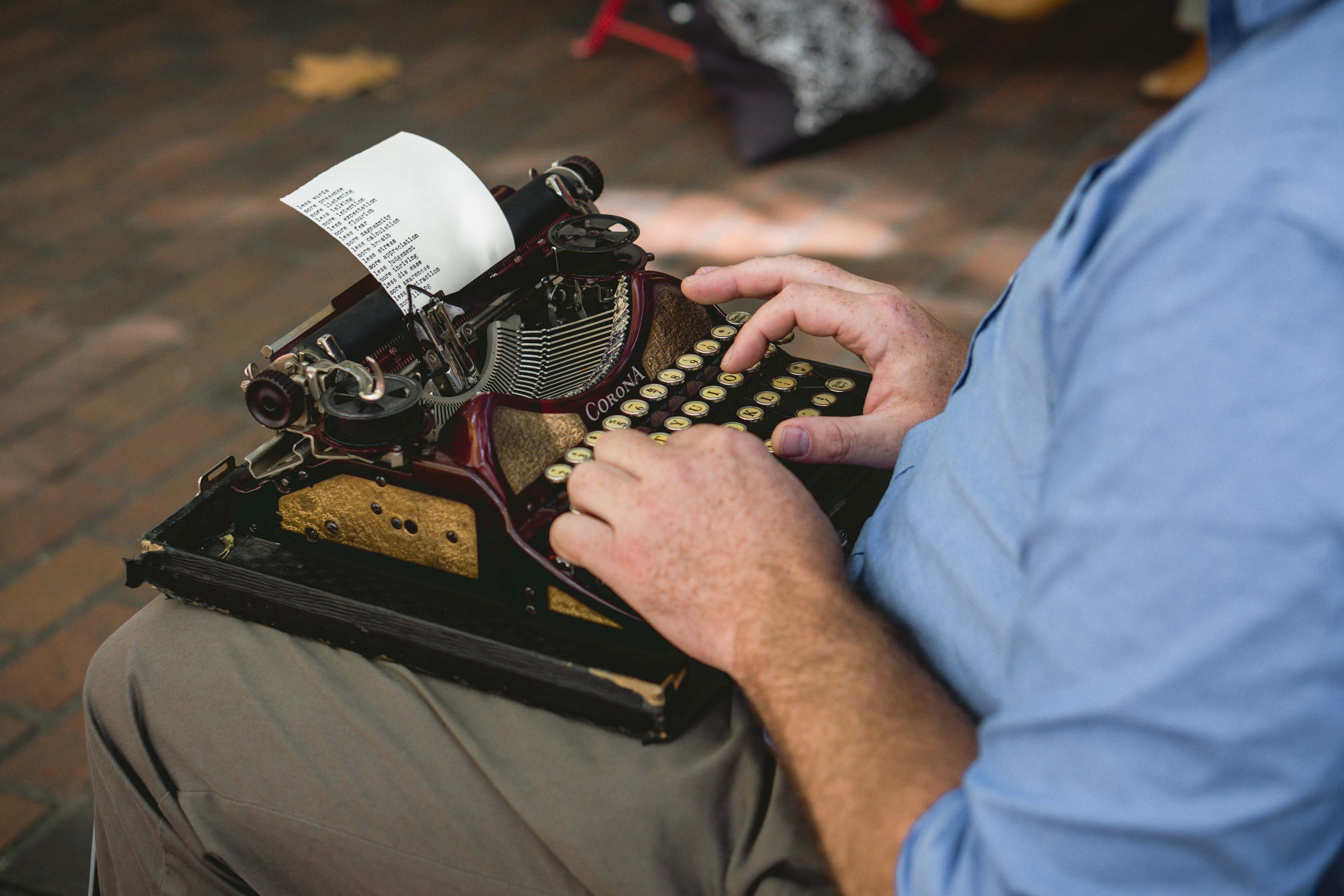typewriter on lap