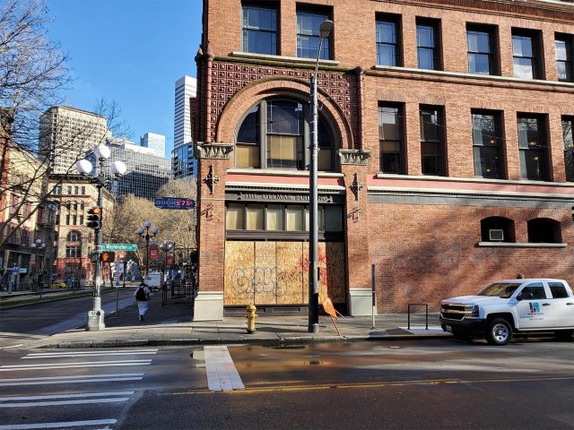 Empty street, boarded up windows
