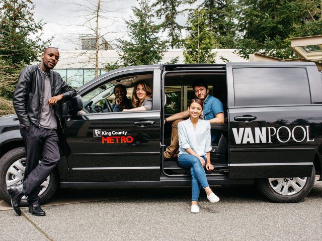 Smiling commuters in a vanpool